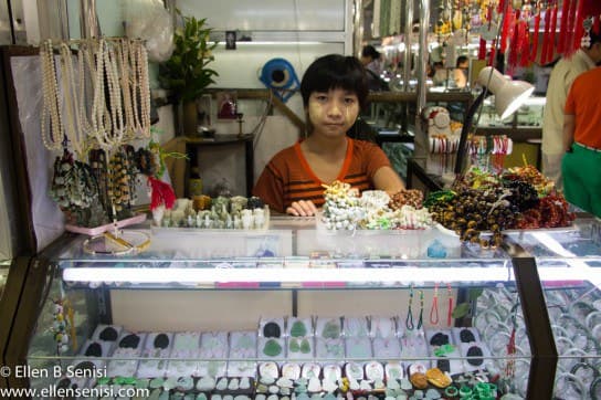 Yangon, Burma, Myanmar. Scotts Market. Child selling in jewelry area of market.